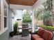 Covered patio with grill and seating area at 3106 W Bay Villa Ave, Tampa, FL 33611