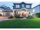 Two-story craftsman home with well-manicured lawn at 3106 W Bay Villa Ave, Tampa, FL 33611