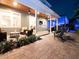 Outdoor living space featuring a covered patio, stone pavers, outdoor furniture and landscaping at 3106 W Bay Villa Ave, Tampa, FL 33611