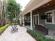 Picturesque backyard featuring an outdoor kitchen, cozy seating, and a fire pit for relaxation and entertaining at 3106 W Bay Villa Ave, Tampa, FL 33611
