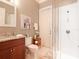 Bathroom featuring a vanity, toilet, artwork, and glass shower with white subway tile at 3106 W Bay Villa Ave, Tampa, FL 33611