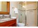 Bathroom featuring a glass enclosed shower, granite countertops, and wood vanity at 3106 W Bay Villa Ave, Tampa, FL 33611