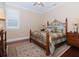 Bedroom with wood floors, area rug, and decorative bedframe at 3106 W Bay Villa Ave, Tampa, FL 33611