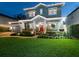 Beautiful two-story home with well-manicured lawn, inviting front porch, and charming curb appeal at 3106 W Bay Villa Ave, Tampa, FL 33611