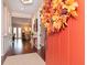 Inviting foyer features a wreath, hardwood floors, and views into the home's living spaces at 3106 W Bay Villa Ave, Tampa, FL 33611