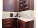 Kitchen wet bar features granite countertops, wine fridge, bar cabinet, and a stylish backsplash at 3106 W Bay Villa Ave, Tampa, FL 33611