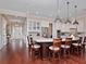 Open kitchen with a large island, stainless appliances, white cabinetry, and wood floors at 3106 W Bay Villa Ave, Tampa, FL 33611