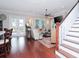 This living room features a ceiling fan, hardwood floors, and staircase at 3106 W Bay Villa Ave, Tampa, FL 33611