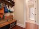A convenient mud room has a coat rack, bench and storage at 3106 W Bay Villa Ave, Tampa, FL 33611