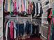 Spacious walk-in closet with custom shelving and hanging rods, offering plenty of storage space for clothes and shoes at 3106 W Bay Villa Ave, Tampa, FL 33611