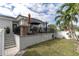 Private backyard oasis with patio, landscaping and a privacy fence at 3925 1St Ne St, St Petersburg, FL 33703