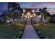 Stunning curb appeal with a landscaped walkway leading to a two-story home at 3925 1St Ne St, St Petersburg, FL 33703