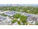 Aerial view showcasing condo and surrounding greenery in a bustling neighborhood with tall buildings at 403 S Oregon Ave, Tampa, FL 33606