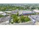 High-angle aerial view of condo with surrounding greenery in commercial district at 403 S Oregon Ave, Tampa, FL 33606
