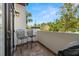 A cozy balcony with two chairs offers a tranquil outdoor retreat at 403 S Oregon Ave, Tampa, FL 33606