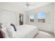 Bedroom with carpet floors, fan, and views of the neighborhood at 403 S Oregon Ave, Tampa, FL 33606