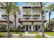 Charming townhouse exterior featuring a red tile roof and well-maintained landscaping at 403 S Oregon Ave, Tampa, FL 33606