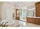 Luxurious bathroom with soaking tub, walk-in shower, and double vanities at 602 Guisando De Avila, Tampa, FL 33613