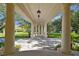 Spacious covered patio with columns and a sitting area at 602 Guisando De Avila, Tampa, FL 33613