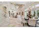 Open concept dining area with a large table and high ceilings at 602 Guisando De Avila, Tampa, FL 33613