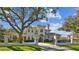 Beautiful home with a gated entrance and a circular driveway at 602 Guisando De Avila, Tampa, FL 33613