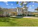 Luxury home showcasing its grand facade and landscaping at 602 Guisando De Avila, Tampa, FL 33613