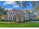 Stunning two-story home with a tile roof and manicured lawn at 602 Guisando De Avila, Tampa, FL 33613