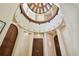 Elegant two-story foyer with a stunning dome ceiling and hardwood floors at 602 Guisando De Avila, Tampa, FL 33613