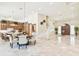 Open concept kitchen and dining area with large island at 602 Guisando De Avila, Tampa, FL 33613