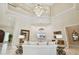 Elegant living room featuring a large chandelier and comfortable seating at 602 Guisando De Avila, Tampa, FL 33613
