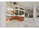 Outdoor kitchen with stainless steel appliances and wood cabinets at 602 Guisando De Avila, Tampa, FL 33613