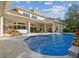 Luxury home with a freeform pool and spacious patio at 602 Guisando De Avila, Tampa, FL 33613