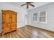 Bedroom with hardwood floors and built-in wooden cabinet at 2307 E 11Th Ave, Tampa, FL 33605