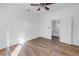 Well-lit bedroom featuring wood floors and an adjacent room at 2307 E 11Th Ave, Tampa, FL 33605