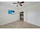 Bright bedroom with tile floors and view of kitchen at 27133 Ipswich Dr, Englewood, FL 34223