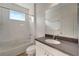 Clean bathroom with tub, toilet and vanity at 27133 Ipswich Dr, Englewood, FL 34223