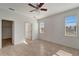 Bright bedroom with tile floors and ceiling fan at 27133 Ipswich Dr, Englewood, FL 34223