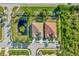 Aerial view of two houses near a pond at 27133 Ipswich Dr, Englewood, FL 34223