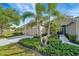 Tan house with attached garage and landscaping at 27133 Ipswich Dr, Englewood, FL 34223
