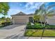 Two-story home with a two-car garage and palm trees at 27133 Ipswich Dr, Englewood, FL 34223