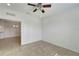 Spacious bedroom with ceiling fan and tile floors at 27133 Ipswich Dr, Englewood, FL 34223