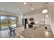 Kitchen with island, stainless steel appliances, and white cabinets at 27133 Ipswich Dr, Englewood, FL 34223