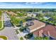 Aerial view of a house near a pond and other homes at 27133 Ipswich Dr, Englewood, FL 34223