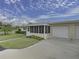 Mid-century modern home with attached garage and screened porch at 2814 Highlands Blvd # B, Palm Harbor, FL 34684