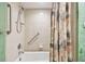 Clean bathroom with shower/tub, tiled walls, and neutral decor at 36750 Us Highway 19 N # 03127, Palm Harbor, FL 34684