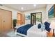 Comfortable bedroom with closet, neutral walls, and sliding glass doors to the outside at 36750 Us Highway 19 N # 03127, Palm Harbor, FL 34684