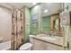 Bathroom with shower/tub combo, granite vanity, and green walls at 36750 Us Highway 19 N # 03127, Palm Harbor, FL 34684