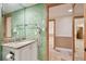 Bathroom with granite vanity, large mirror, and view to another room at 36750 Us Highway 19 N # 03127, Palm Harbor, FL 34684