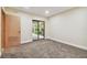 Bedroom with sliding glass doors leading to a patio at 36750 Us Highway 19 N # 03127, Palm Harbor, FL 34684