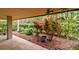 Charming patio area with landscaping and lush greenery, perfect for relaxation at 36750 Us Highway 19 N # 03127, Palm Harbor, FL 34684